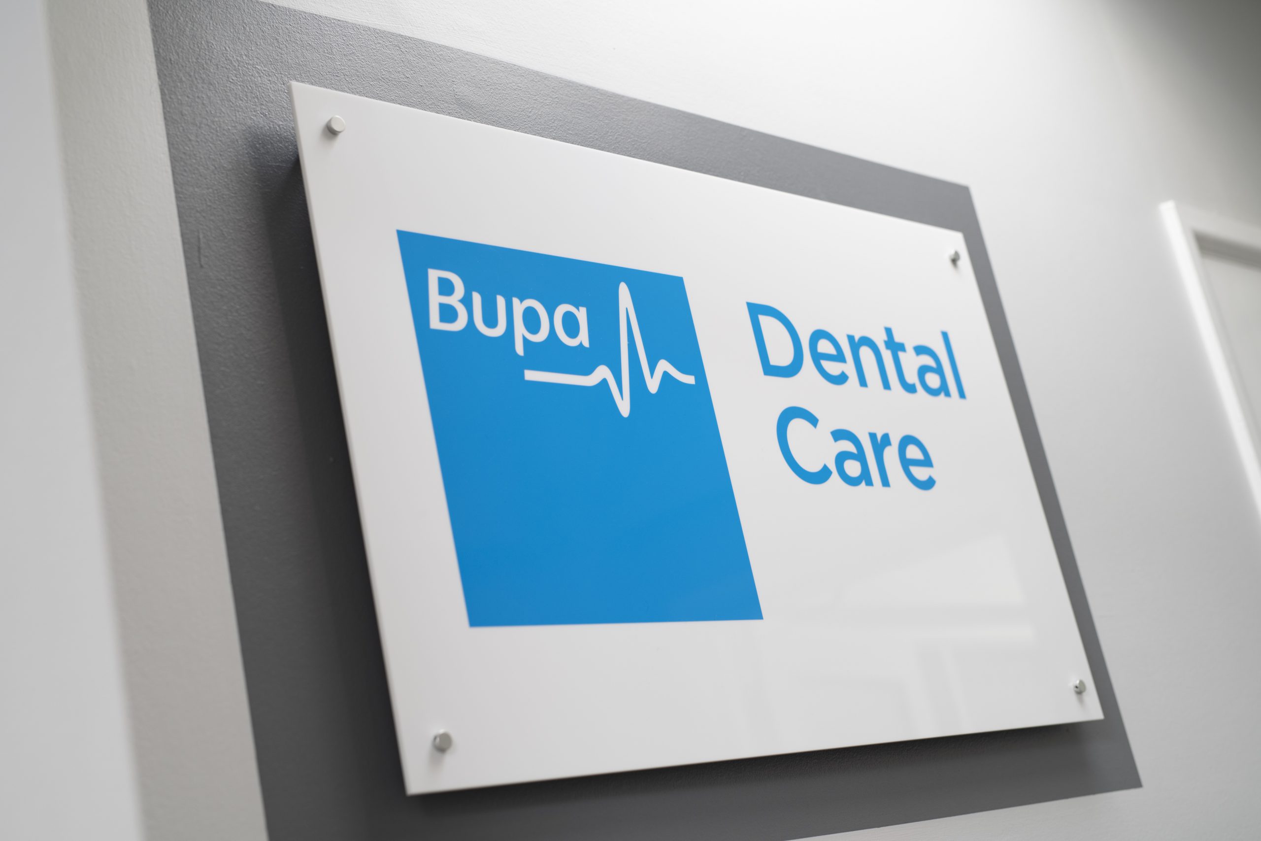 Bupa Dental Care logo on a sign